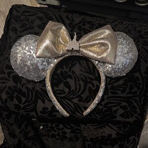 Disney Minnie Mouse ears.  Silver and gold with rhinestone castles